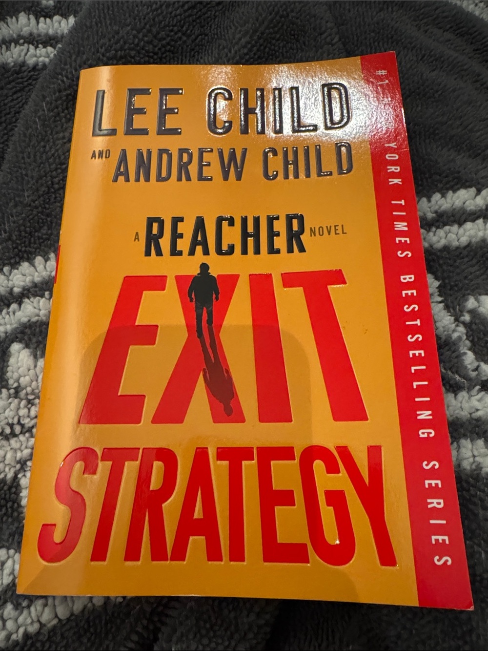 Exit Strategy by Lee Child & Andrew Child - Bold Yellow/Red Paperback